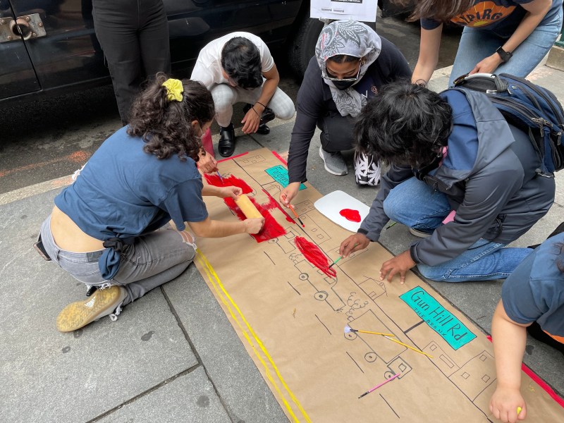 Painting bus lanes is as easy at it looks. Photo: Dave Colon