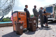 Mayor Adams stood next to a selection of Sanitation compost bins at last week's announcement. Photo: Mayor's Office