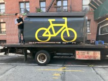 One and done: An Oonee mini being removed from Astoria after this year's successful test.